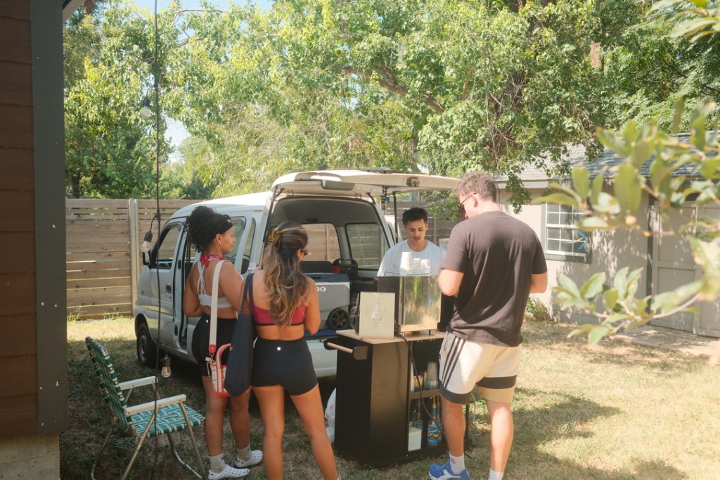 Backyard pop-up with guests at the cart