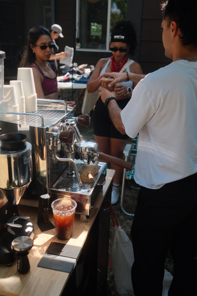 Handing an iced coffee to a guest