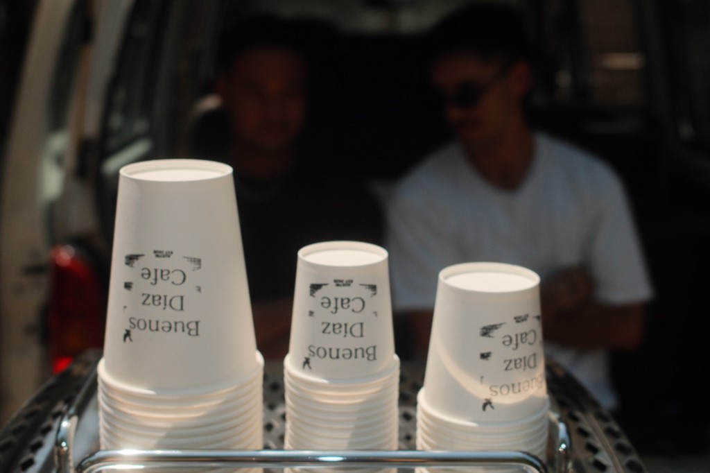 Buenos Diaz Cafe cups stacked on the machine